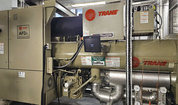 A machine with pipes and a sign

Description automatically generated with medium confidence